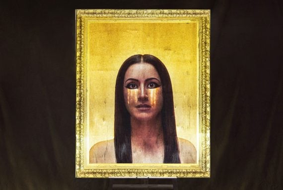 female portrait projected onto a framed canvas