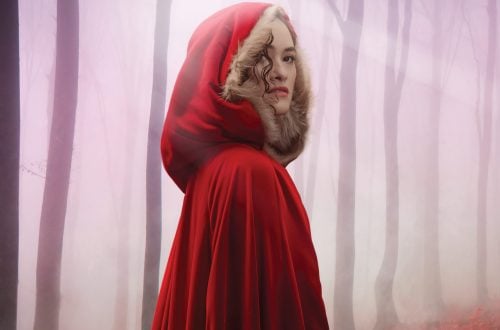 Young woman in a red cape as Little red riding hood in the musical Into the Woods. Presented by Opera Queensland in Brisbane and Queensland Theatre. Playing at QPAC Glasshouse Theatre in 2026